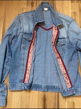 Anthropologie Light-wash denim with pink/red silk trim embellishments. Size 10